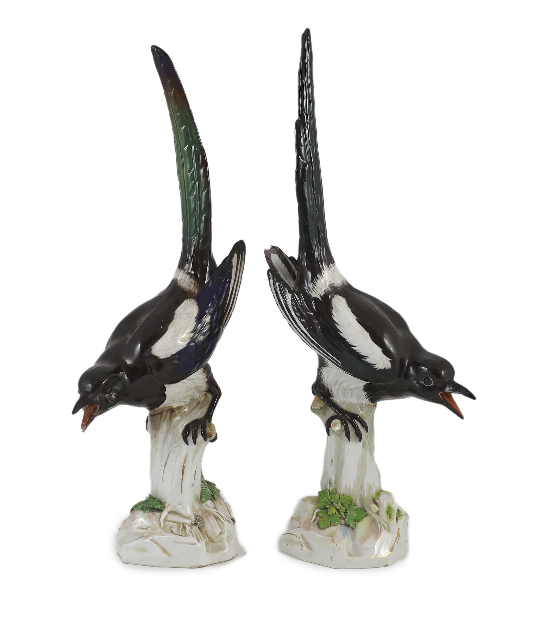 A pair of large Meissen figures of magpies, late 19th century, Tallest 53.5 cm, restorations